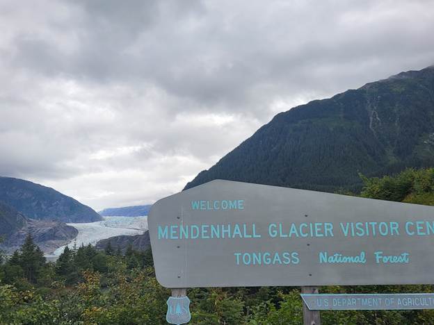 A sign with mountains in the background

AI-generated content may be incorrect.