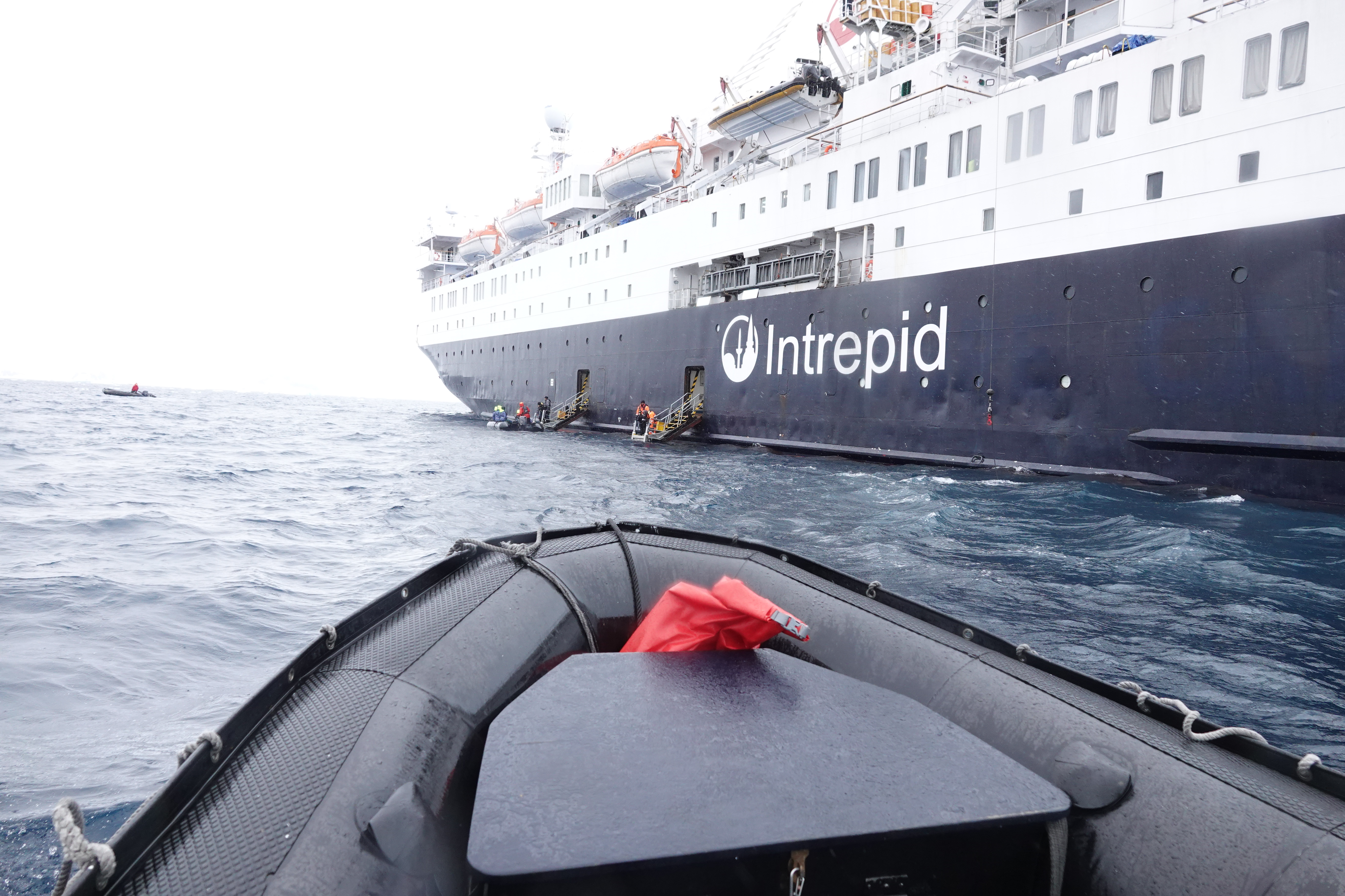 Zodiak approaching ship