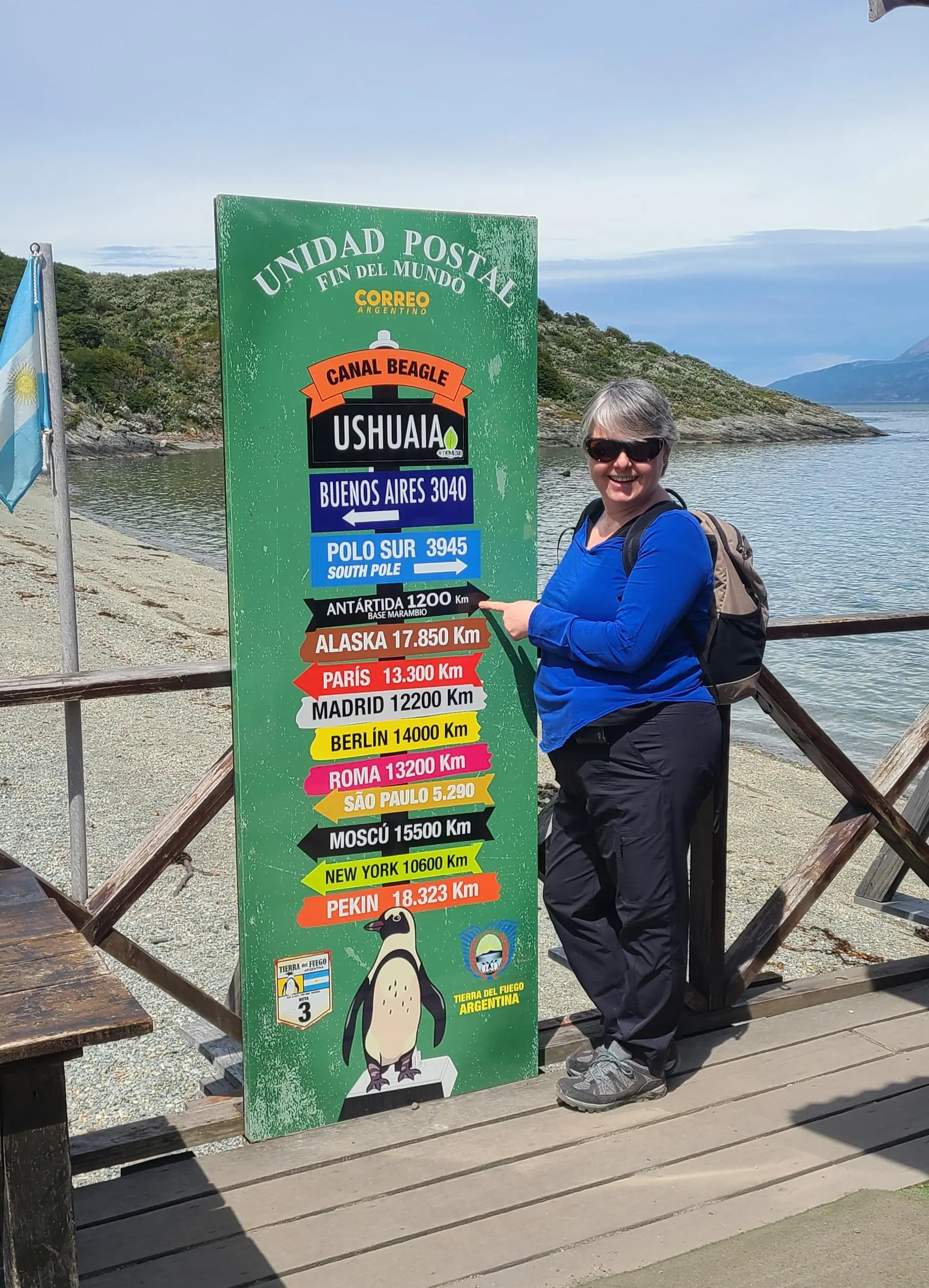 Anne with Destination Sign at Ushuaia Post Office