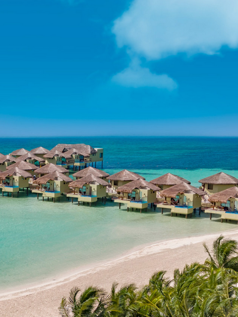 Discover Tropical Romance in 3 Overwater Bungalow Resorts on the Caribbean Sea
