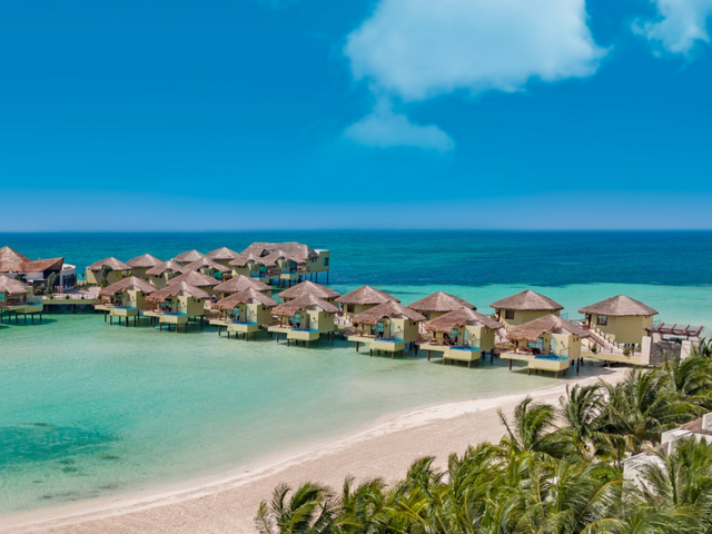 Discover Tropical Romance in 3 Overwater Bungalow Resorts on the Caribbean Sea