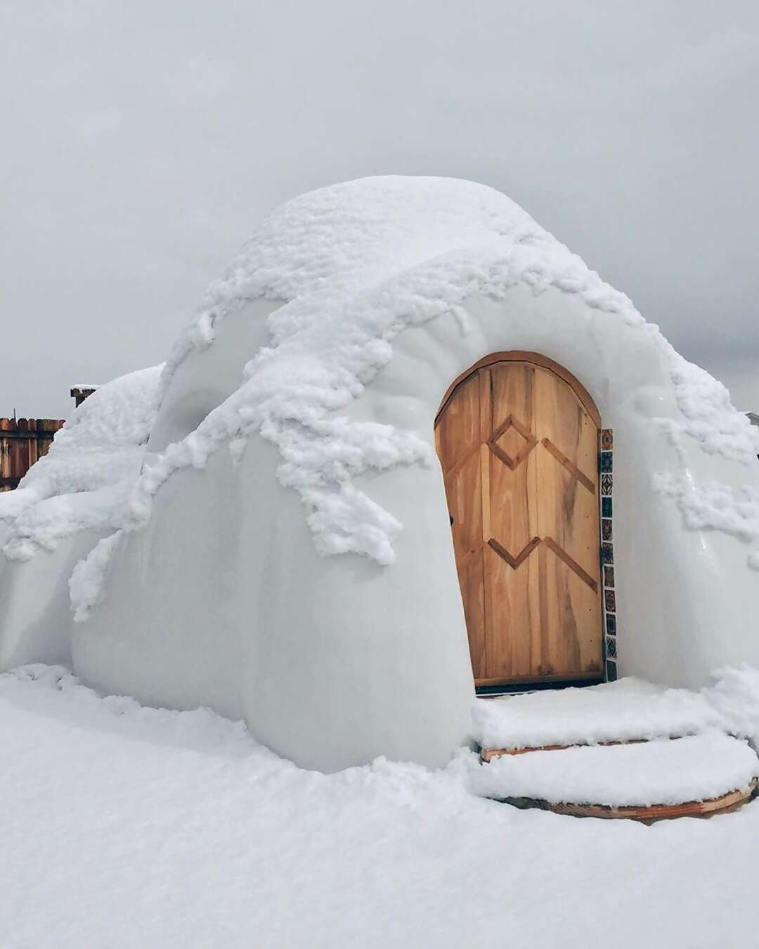 Our #10 home for the holidays is Superhost Emily’s creative cabin-and-igloo combo in the high desert