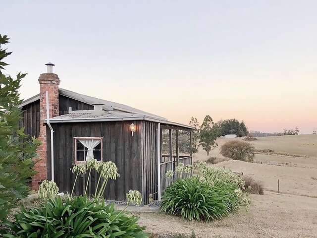 Cassie’s restored 1940s cabin sits on 140 acres of tranquil vineyard and farmland
