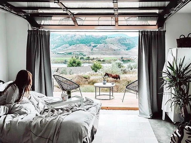 At Superhost Catherine’s cozy studio, your front door is a wall that opens up onto the Shuswap Highland and the South Thompson Ri